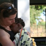 Volunteer With Child In Malawi